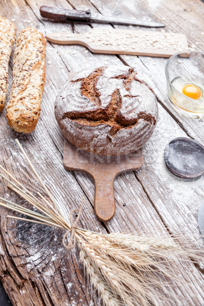 Delicious fresh bread on wooden background Stock photo © tommyandone