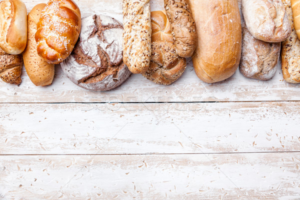 Delicious fresh bread on wooden background Stock photo © tommyandone