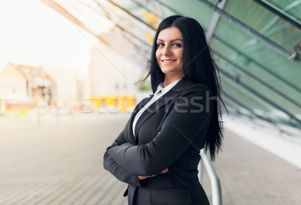 Stock photo: Beautiful young business woman in urban setting