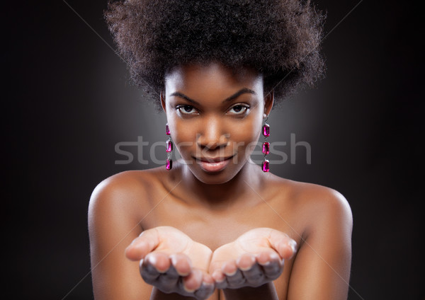 Black beauty reaching out hands Stock photo © tommyandone