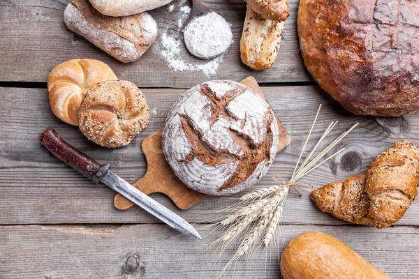 Delicious fresh bread on wooden background Stock photo © tommyandone