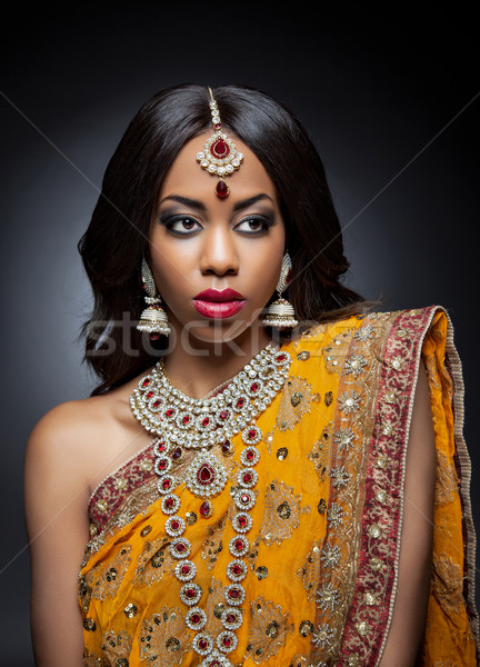 Young Indian woman in traditional clothing with bridal makeup and jewelry Stock photo © tommyandone