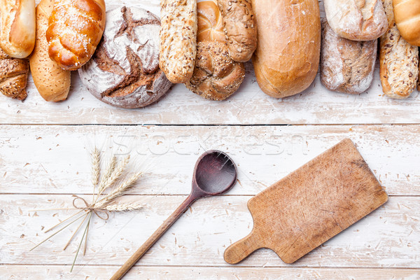 Stock photo: Delicious fresh bread on wooden background