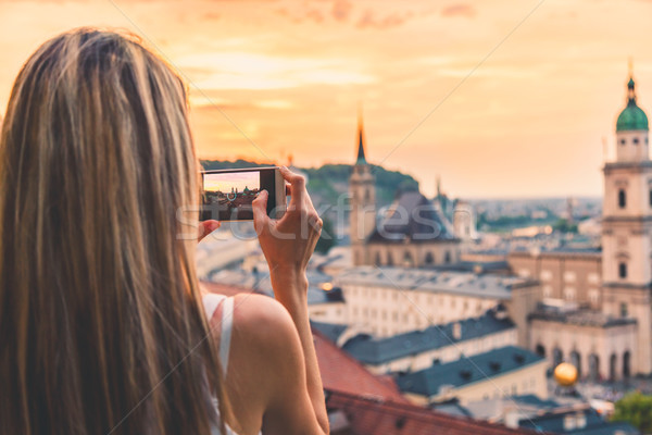 Tourist taking a photo of beatiful sunset in Salzburg Austria Stock photo © tommyandone