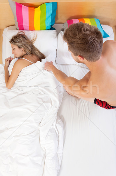Get the duvet back from sleeping wife Stock photo © tommyandone