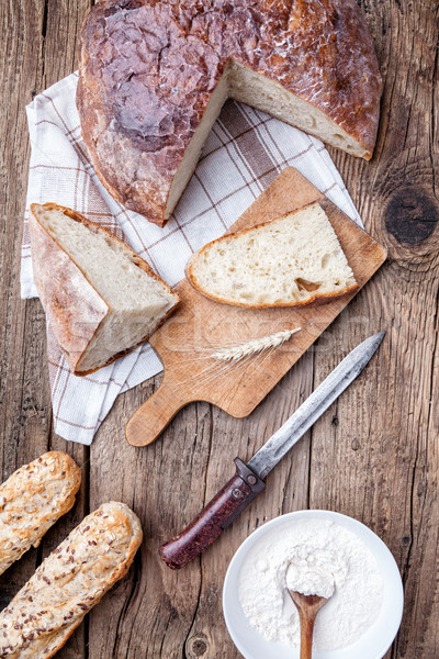 Delicious fresh bread on wooden background Stock photo © tommyandone