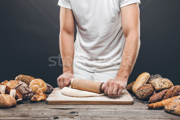 Baker with a variety of delicious freshly baked bread and pastry Stock photo © tommyandone