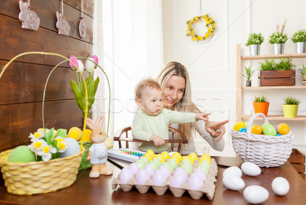 Easter concept. Happy mother and her cute child getting ready for Easter  Stock photo © tommyandone