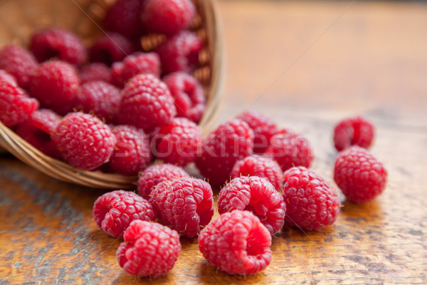 Fresh and tasty raspberries on a wooden table Stock photo © tommyandone