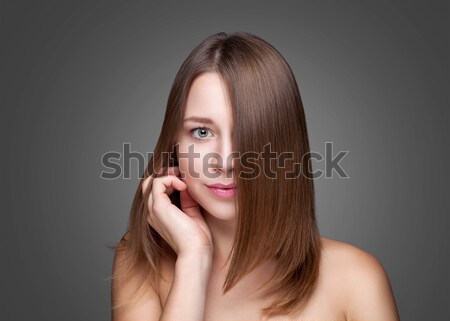 Beautiful brunette with long straight hair Stock photo © tommyandone