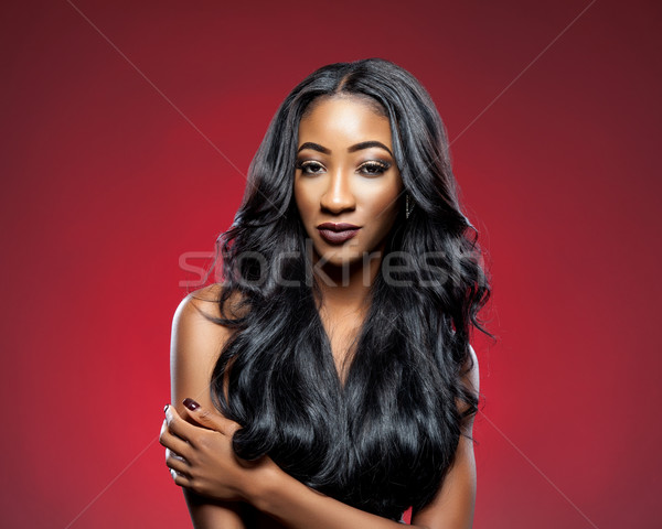 Black woman with long luxurious shiny hair Stock photo © tommyandone