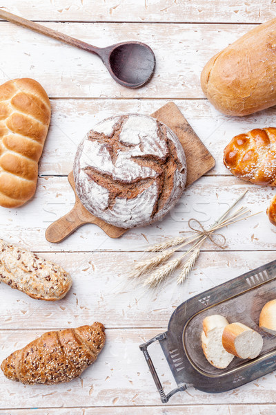 Delicious fresh bread on wooden background Stock photo © tommyandone