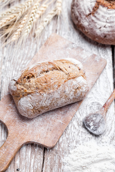 Delicious fresh bread on wooden background Stock photo © tommyandone