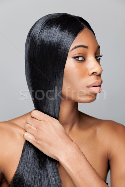 Black beauty with long straight hair Stock photo © tommyandone