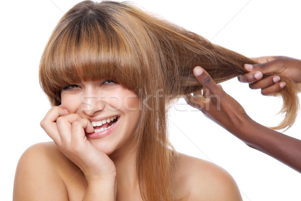 Smiling beauty getting her hair done Stock photo © tommyandone