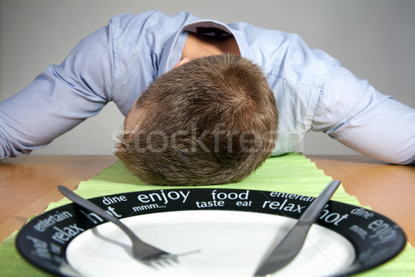 Falling asleep on a table Stock photo © tommyandone