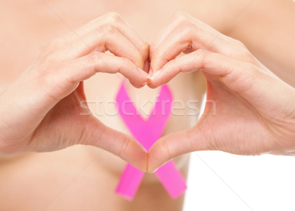 Woman with a breast cancer awareness ribbon Stock photo © tommyandone