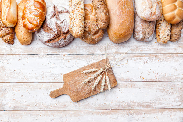 Delicious fresh bread on wooden background Stock photo © tommyandone