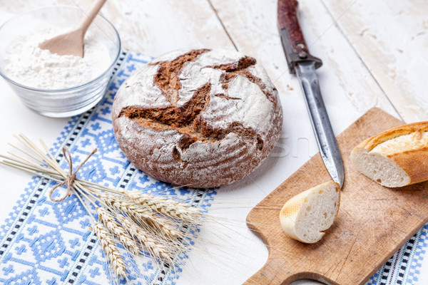 Delicious fresh bread on wooden background Stock photo © tommyandone