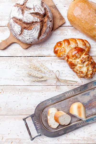 Delicious fresh bread on wooden background Stock photo © tommyandone