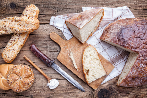 Delicious fresh bread on wooden background Stock photo © tommyandone