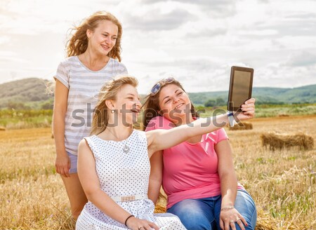 Stock photo: Group of friends having a good time outdoors