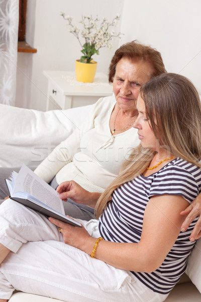 Carer spending time with an elderly woman Stock photo © tommyandone