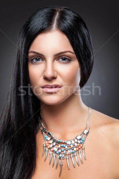 Fiatal szépség hosszú sötét haj visel nyaklánc Stock fotó © tommyandone