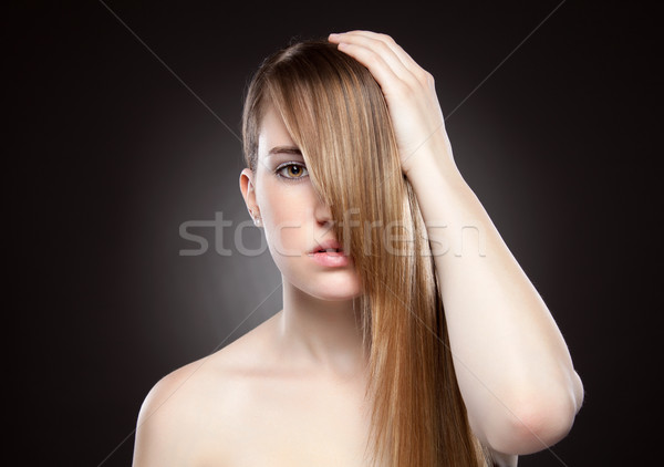 Young beauty with long straight hair Stock photo © tommyandone
