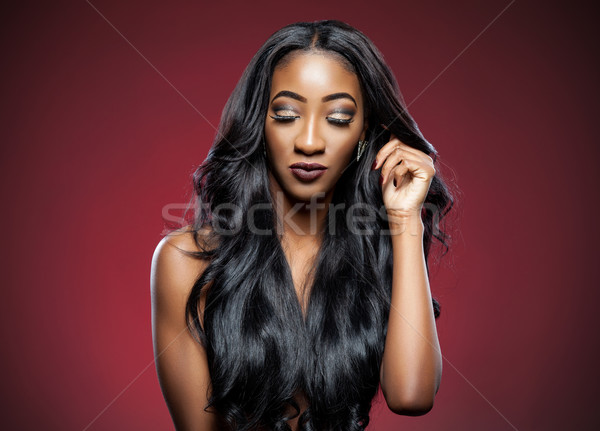 Black woman with long luxurious shiny hair Stock photo © tommyandone