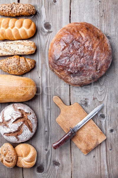 Delicious fresh bread on wooden background Stock photo © tommyandone