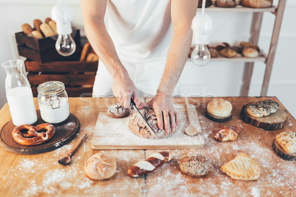 Baker with a variety of delicious freshly baked bread and pastry Stock photo © tommyandone