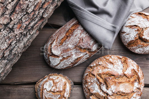 Delicious fresh bread on wooden background Stock photo © tommyandone