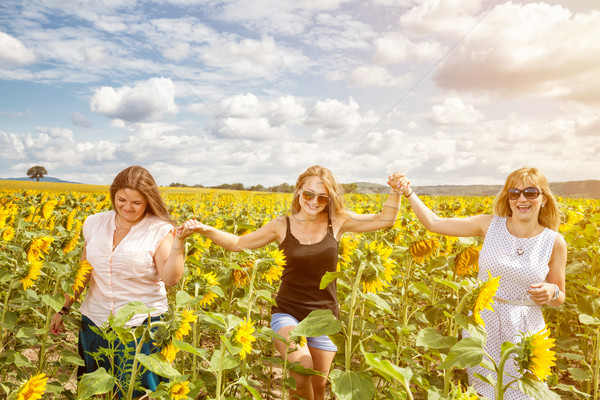 Group of friends having fun outdoors Stock photo © tommyandone