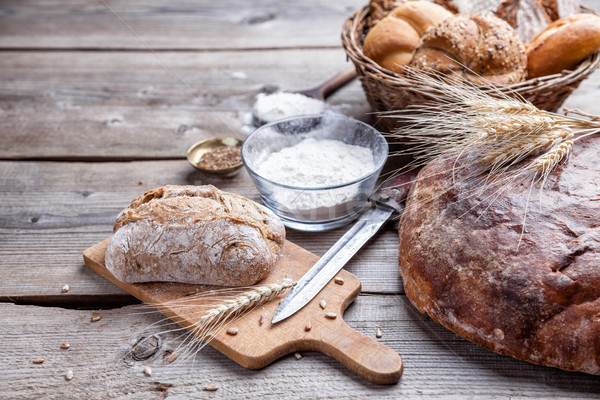 Delicious fresh bread on wooden background Stock photo © tommyandone