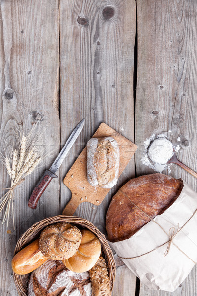 Delicious fresh bread on wooden background Stock photo © tommyandone
