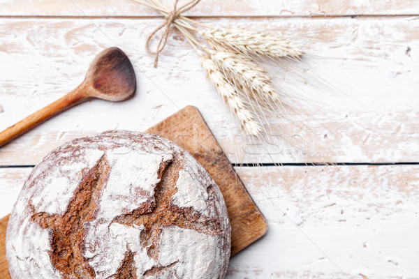 Delicious fresh bread on wooden background Stock photo © tommyandone