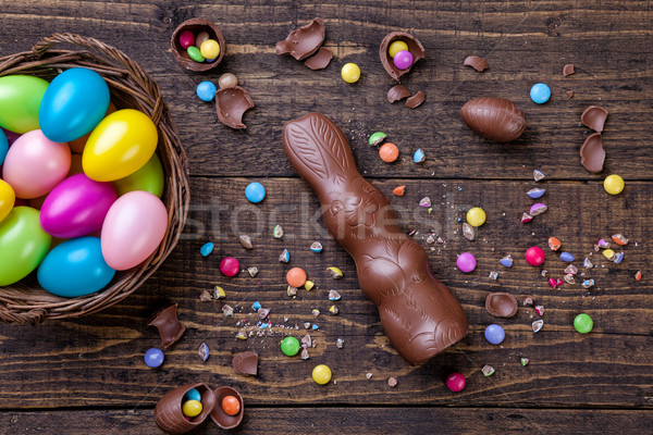 Chocolate easter eggs and sweets on wooden background Stock photo © tommyandone