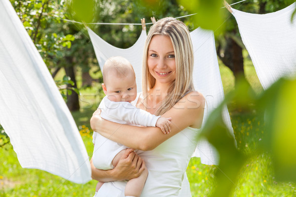 Stock photo: Beautiful mother and baby playing together outdoors