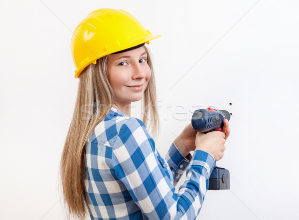 Woman doing the DIY work and wearing protective helmet Stock photo © tommyandone