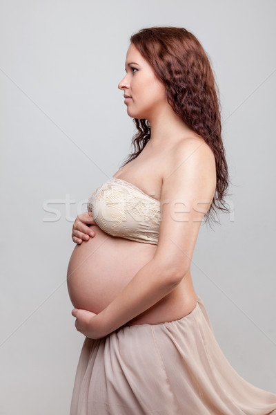 Portrait femme enceinte cheveux bouclés ventre femme [[stock_photo]] © tommyandone