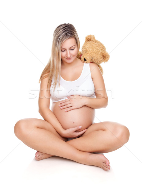 Portret kobieta w ciąży posiedzenia piętrze brzuch Zdjęcia stock © tommyandone