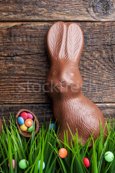 Chocolate Easter bunny and eggs on wooden background Stock photo © tommyandone