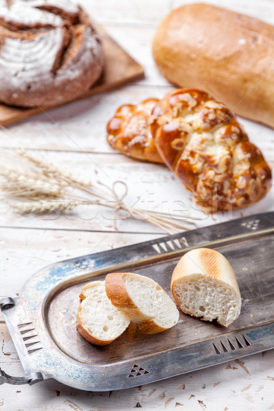 Delicious fresh bread on wooden background Stock photo © tommyandone