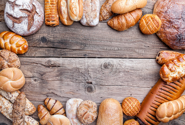 Delicious fresh bread on wooden background Stock photo © tommyandone