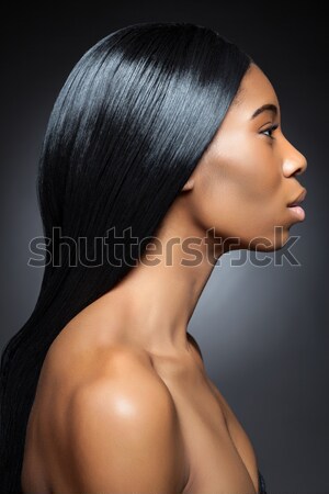 Profile of an young black beauty with long straight hair Stock photo © tommyandone