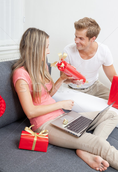 Happy couple exchanging gifts  Stock photo © tommyandone