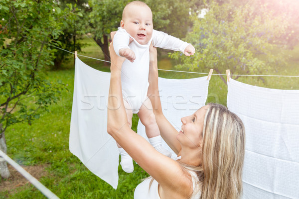 Gyönyörű anya baba játszik együtt kint Stock fotó © tommyandone