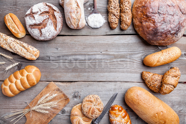 Delicious fresh bread on wooden background Stock photo © tommyandone