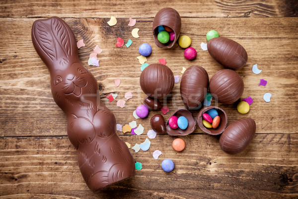 Chocolate easter eggs and sweets on wooden background Stock photo © tommyandone